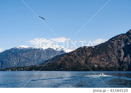 Motor yacht sails on Lake Como. Bellagio, Italy Motor yacht sails on Lake Como. Bellagio, Italy 91584520