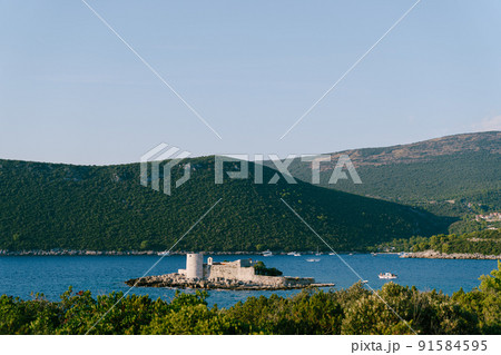 Island of Otocic Gospa in the bay. Montenegro Island of Otocic Gospa in the bay. Montenegro 91584595
