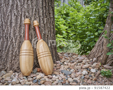 pair of wooden Indian exercise clubs pair of wooden Indian exercise clubs 91587422