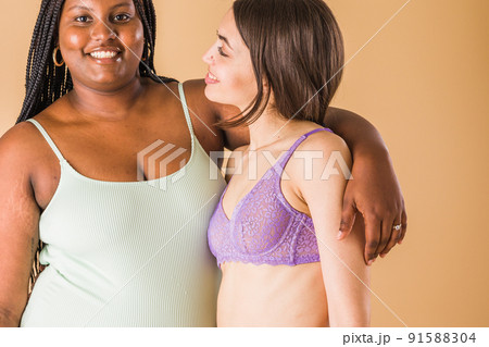 body positivity and inclusivity feminity friends. interracial Moroccan and Cuban Latin woman 91588304