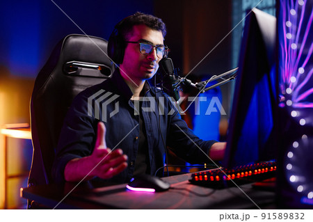 Man Speaking to Mic at Podcast Man Speaking to Mic at Podcast 91589832