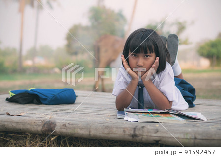 Girl in the countryside of Thailand. 91592457
