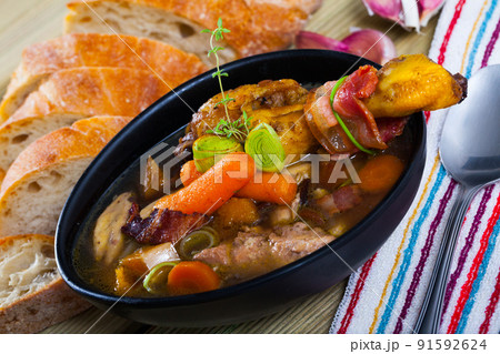 Chicken soup with bacon and vegetables 91592624