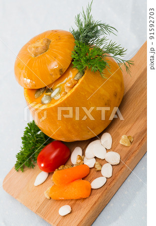 Recipe of squash soup in baked pumpkin 91592703