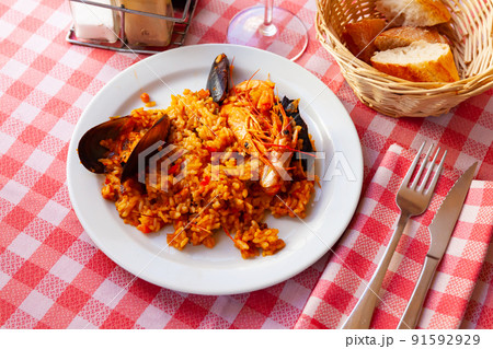 Spainsh dish seafood paella with rice, shrimps and mussels Spainsh dish seafood paella with rice, shrimps and mussels 91592929