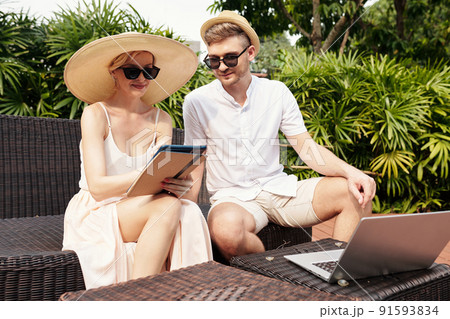 Man And Woman Working Outdoors Man And Woman Working Outdoors 91593834