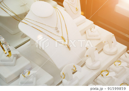 Jewelry diamond shop with rings and necklaces luxury retail store window display Jewelry diamond shop with rings and necklaces luxury retail store window display 91599859