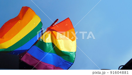 Pride rainbow lgbt gay flag being waved on sky background 91604881