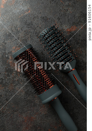 Hairbrushs on dark textured background, close up 91606154