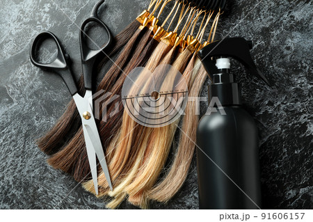 Composition with hair extension accessories on dark background Composition with hair extension accessories on dark background 91606157