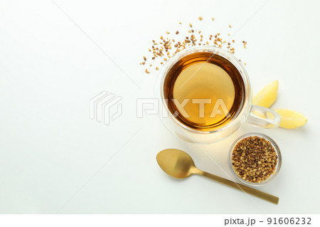 Concept of hot drink with buckwheat tea on white background Concept of hot drink with buckwheat tea on white background 91606232