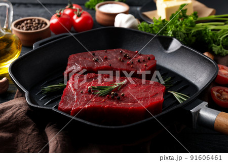 Concept of tasty food with raw beef steaks, close up Concept of tasty food with raw beef steaks, close up 91606461