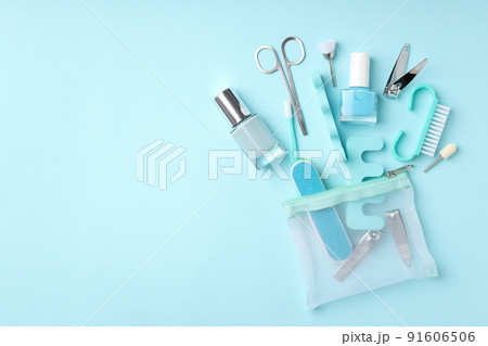Concept of nail care with manicure accessories on blue background Concept of nail care with manicure accessories on blue background 91606506