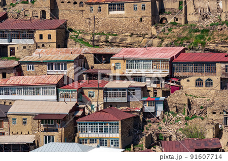 facades of houses located in tiers on a steep slope in the village of Chokh in Dagestan 91607714