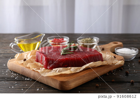 Concept of cooking with raw steak, close up Concept of cooking with raw steak, close up 91608612