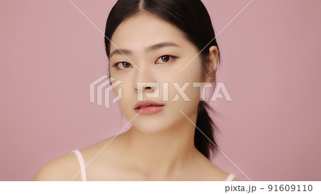 Close up face of beautiful young Asian woman with clear skin on pink background. 91609110