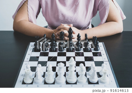 The chess board shows leadership, Hand of businesswoman moving, chess in competition shows leadership, followers, and business success strategies 91614613