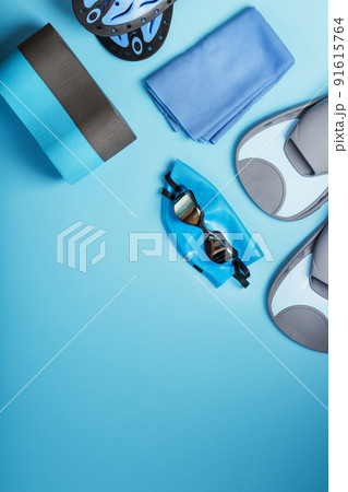 Set for training and learning to swim in the pool and open water on a blue background 91615764