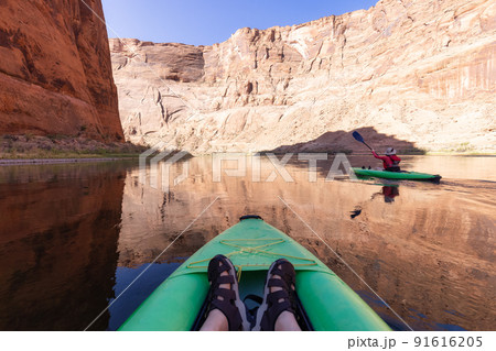 Adventurous Woman on a Kayak paddling in Colorado River. Glen Canyon, Arizona 91616205