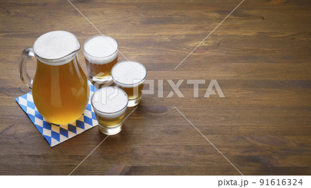 Banner Oktoberfest beer in a jug and glasses Banner Oktoberfest beer in a jug and glasses 91616324