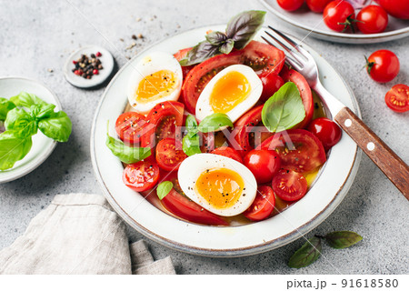 Tomato and boiled egg summer salad Tomato and boiled egg summer salad 91618580
