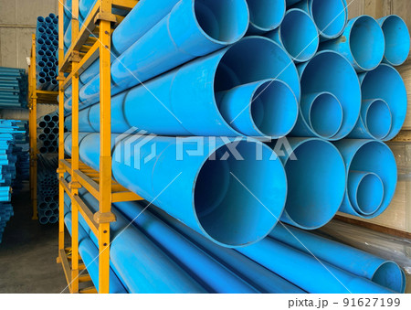 PVC pipes stacking on shelf in warehouse 91627199