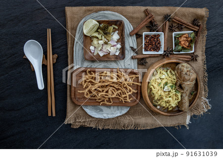 Northern Style Curried Noodle Soup with coconut milk (Khao soi), Traditional of Northern Thai cuisine. 91631039