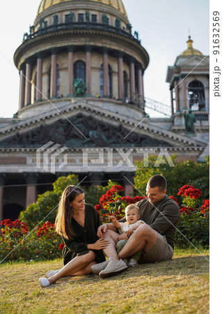 happy family in front of st Isaac's Cathedral, Saint petersburg. summer in city 91632569
