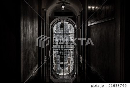 View from Loha Prasat Metal Palace at Ratchanaddaram temple through the gate. Loha Prasat Metal Palace is famous tourist destination in Bangkok, Thailand. View from Loha Prasat Metal Palace at Ratchanaddaram temple through the gate. Loha Prasat Metal Palace is famous tourist destination in Bangkok, Thailand. 91633746