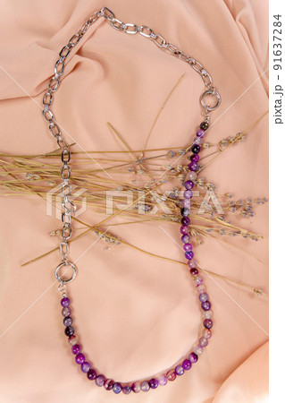A necklace with the silver and a chain, with beads of lavender amethyst. Handmade jewelry. Vertical photo A necklace with the silver and a chain, with beads of lavender amethyst. Handmade jewelry. Vertical photo 91637284