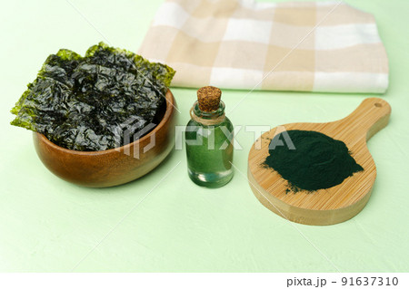Algae based alternative vegan oil, close up. Spirulina, selective focus. Ecological product Algae based alternative vegan oil, close up. Spirulina, selective focus. Ecological product 91637310