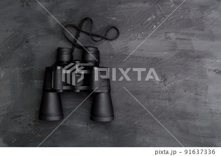 Binoculars on a black background top view. Space for copying text Binoculars on a black background top view. Space for copying text 91637336