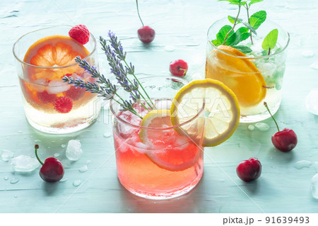 Summer cocktails or mocktails, cold drinks with citrus fruits and lavender 91639493