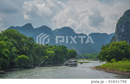 Tourist boat sailing on a Li River in China 91641790