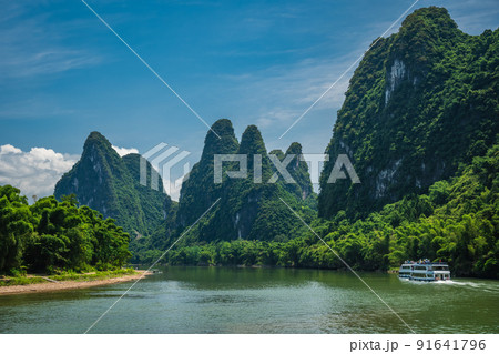 Tourist boat sailing on a Li River in China 91641796