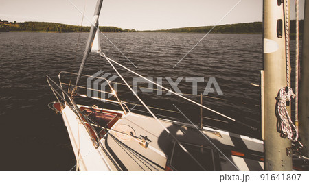 Boat on the shore of a lake in summer Boat on the shore of a lake in summer 91641807