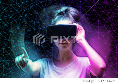 Defocused portrait of young caucasian woman in VR glasses with reaches hand. Dark neon mesh background. The concept of metaverse, virtual reality and cyberspace 91646677