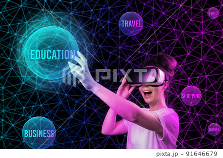 Portrait of happy woman in VR glasses with hand reaches to spheres of interest. Black background with neon abstract grid. The concept of choice, cyberspace and virtual reality 91646679