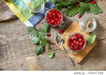Homemade dogwood jam on a wooden background. Organic jam, healthy food. View from above. Copy space. Homemade dogwood jam on a wooden background. Organic jam, healthy food. View from above. Copy space. 91647388