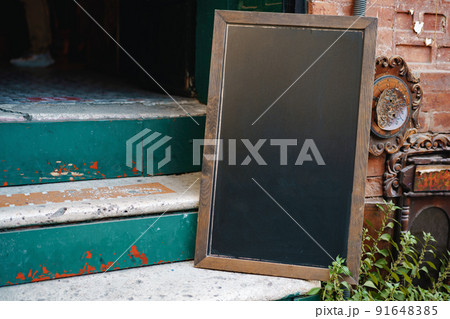 Cafe blank signboard on the street mock up 91648385