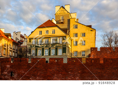 Historic buildings and red brick walls of Warsaw Barbican Poland at sunset in spring 91648928