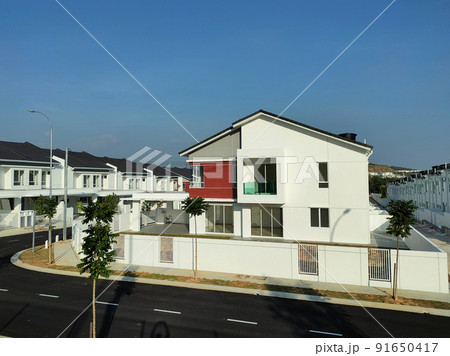 SELANGOR, MALAYSIA -MAY 2, 2022: Selected focused on new double story terrace house under construction in Malaysia. Construction progress is almost complete and almost ready to be occupied. SELANGOR, MALAYSIA -MAY 2, 2022: Selected focused on new double story terrace house under construction in Malaysia. Construction progress is almost complete and almost ready to be occupied. 91650417