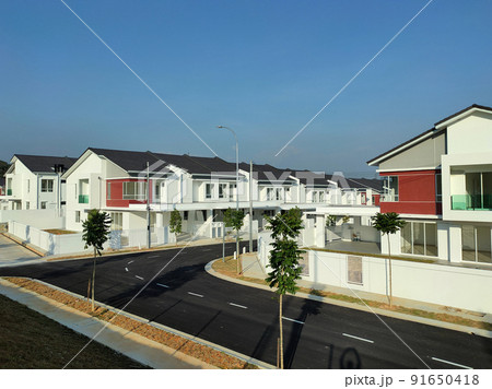 SELANGOR, MALAYSIA -MAY 2, 2022: Selected focused on new double story terrace house under construction in Malaysia. Construction progress is almost complete and almost ready to be occupied. SELANGOR, MALAYSIA -MAY 2, 2022: Selected focused on new double story terrace house under construction in Malaysia. Construction progress is almost complete and almost ready to be occupied. 91650418