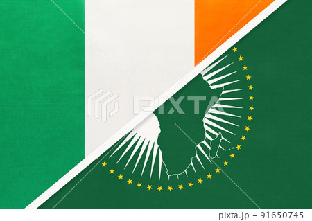 Ireland and African Union national flag from textile. Africa continent vs Irish national flags Ireland and African Union national flag from textile. Africa continent vs Irish national flags 91650745