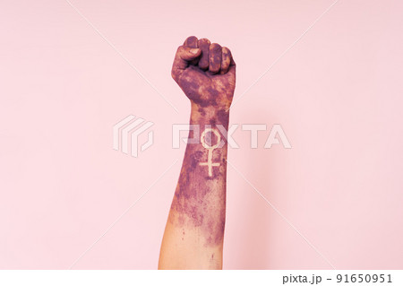 Woman's hand in purple paint and the sign of the mirror of Venus Woman's hand in purple paint and the sign of the mirror of Venus 91650951