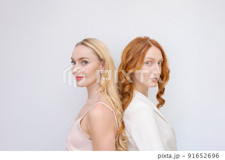 Beauty picture gorgeous happy optimistic beautiful blonde and redhead women Beauty picture gorgeous happy optimistic beautiful blonde and redhead women 91652696