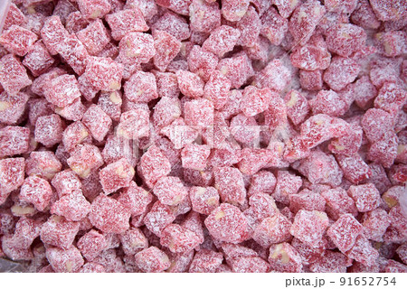 Dried fruits and berries on gray background top view. Lemons, oranges, bananas, raisins, cranberries 91652754