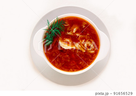 Traditional Russian cabbage soup in a ceramic bowl on a white insulated background. Flat lay. Traditional Russian cabbage soup in a ceramic bowl on a white insulated background. Flat lay. 91656529