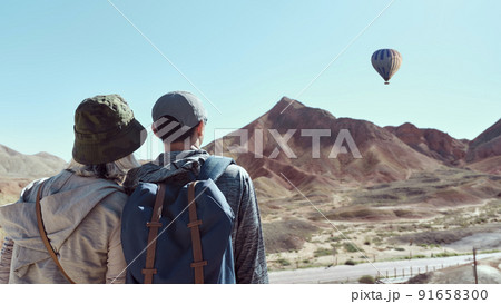 rear view of an asian couple tourists looking at view in national geological park rear view of an asian couple tourists looking at view in national geological park 91658300