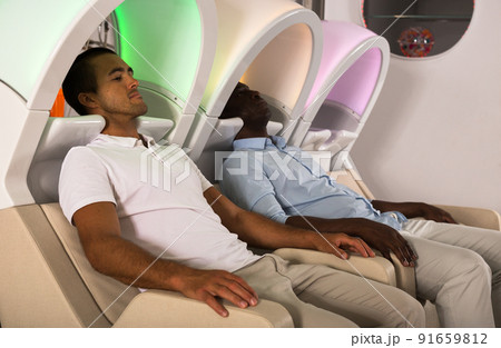 Male clients sitting in hair washing chairs 91659812